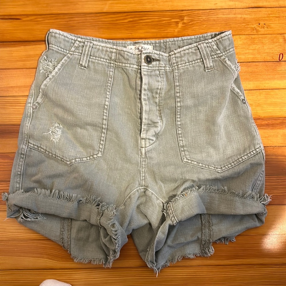 We the Free army cargo shorts. Green distressed. Size 8. Button fly.